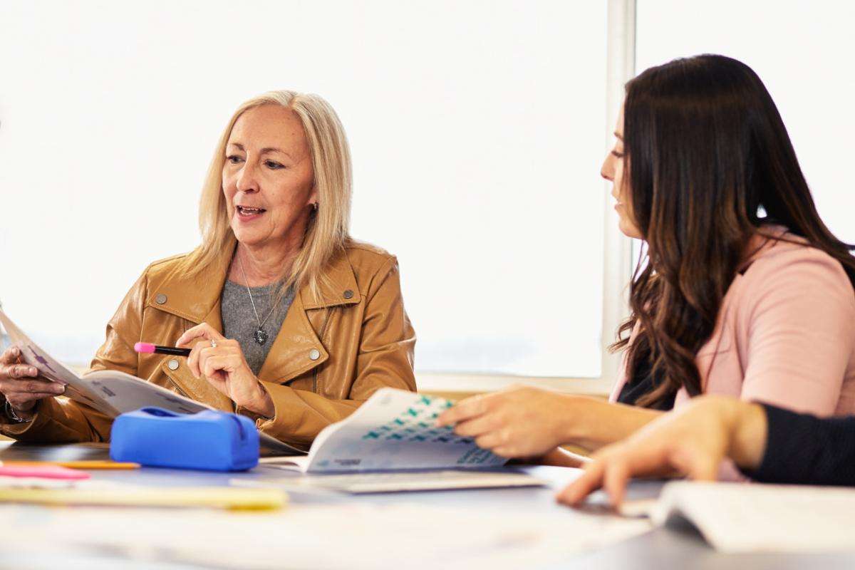 two woman sitting at table two woman sitting at table